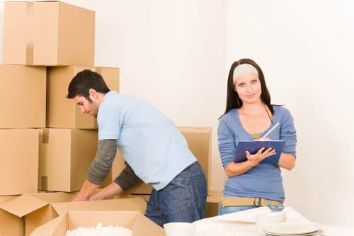 Professional movers handling belongings in Kensington