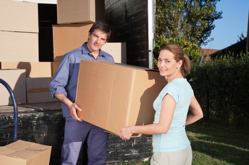 Professional movers handling office equipment in Kensington